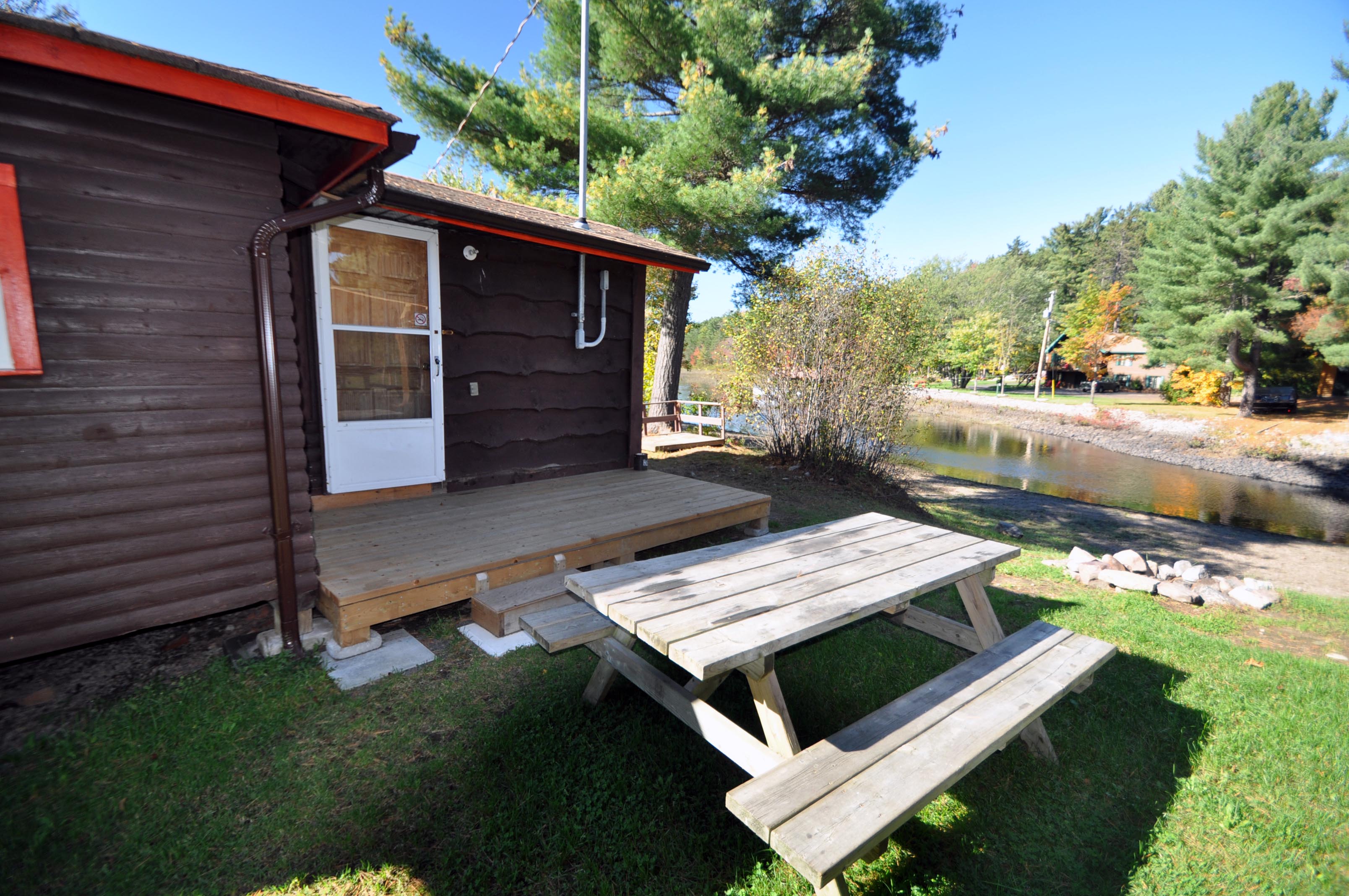 Cabin 6 - exterior with picnic table.