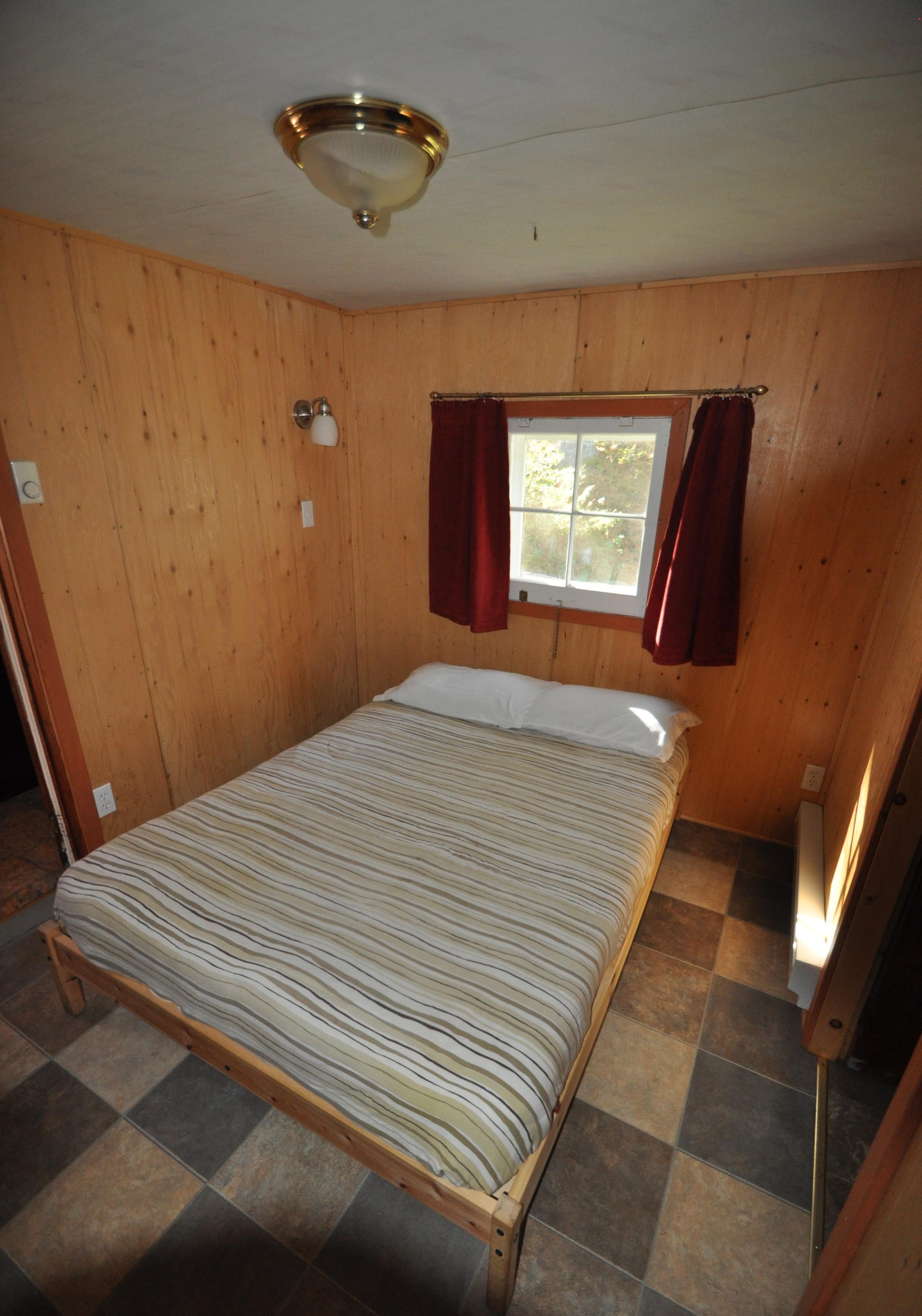 Cabin 7 - bedroom with full bed.