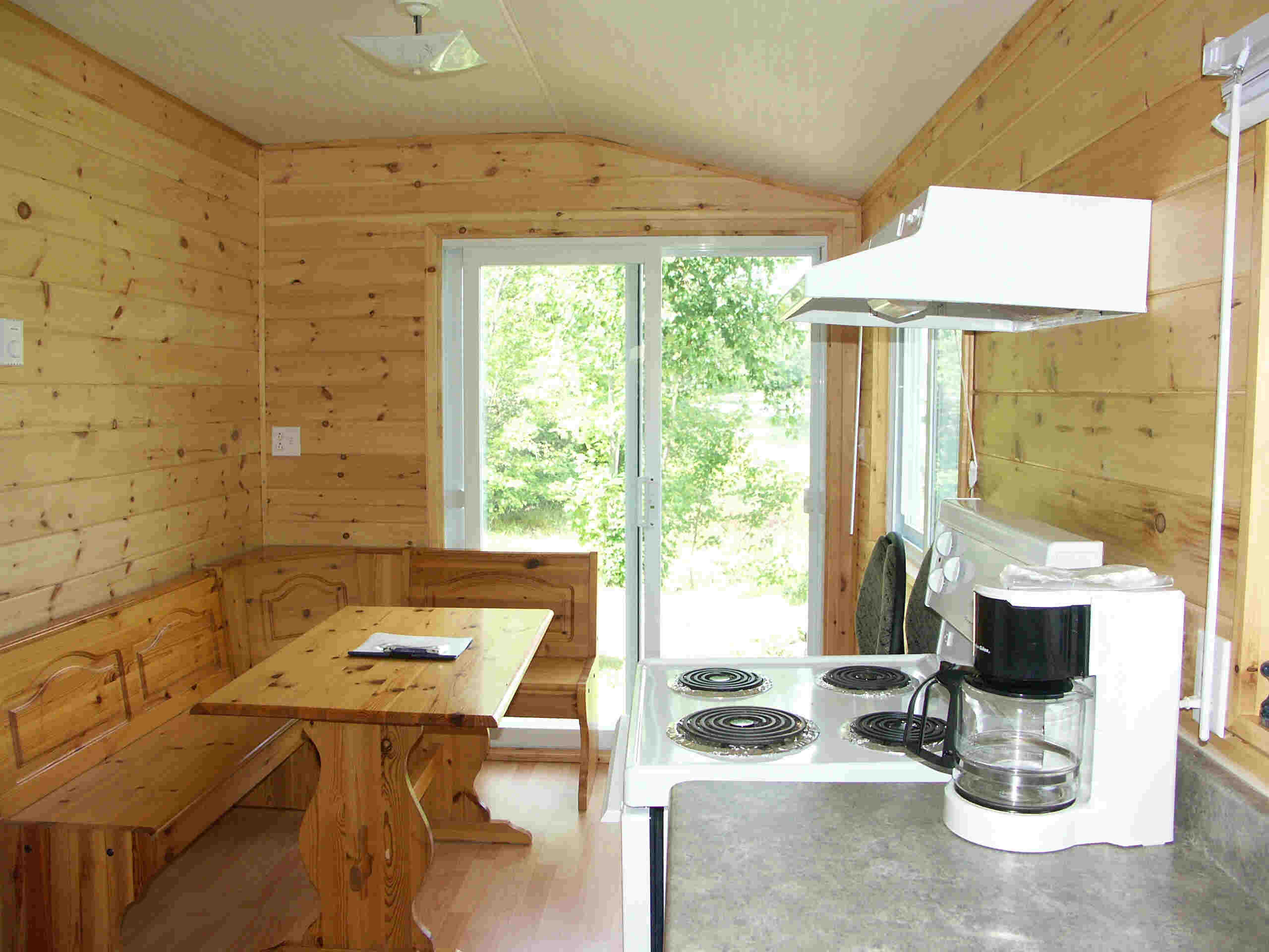 Cabin 8 - kitchen and corner dining table.