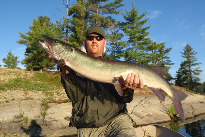 Man holding a muskie.