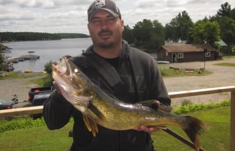 Mike holding a 28 inch walleye.