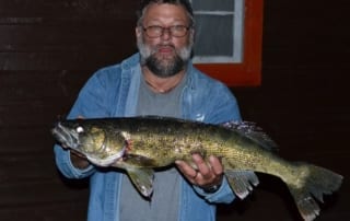 Mike holding 29 inch walleye.
