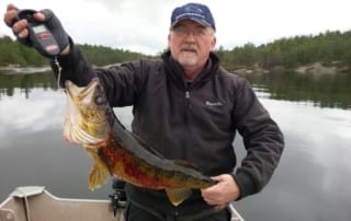Bob holding 27 inch walleye.