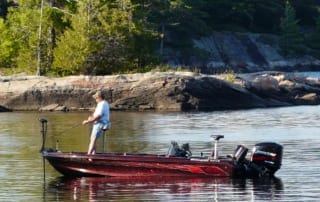Man fishing off a boat.