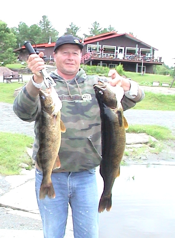 Dave holding walleyes.