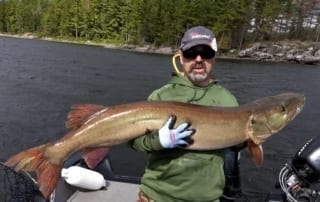 Photo of a man holding a massive catch at Wolseley Lodge